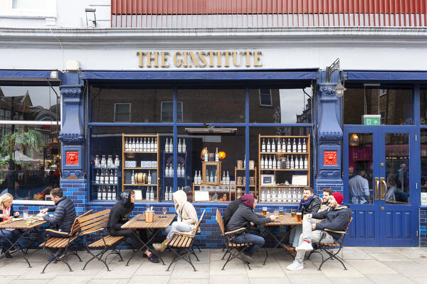 People drinking outside a pub in Notting Hill, London, Great Britain, UK