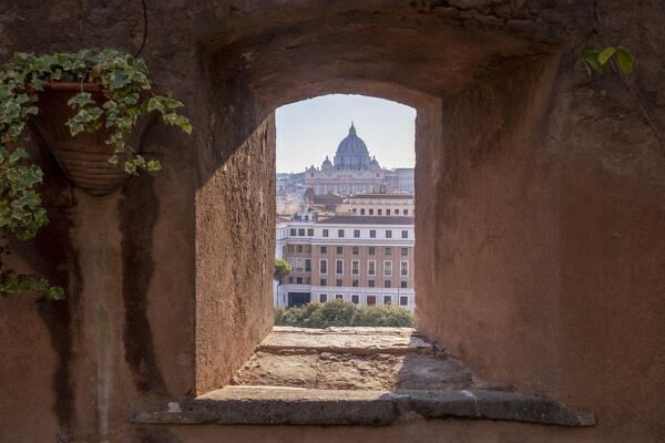 The Dome of St. Peter's Basilica view from a window in Castel Sant'Angelo, Rome, Lazio, Italy.