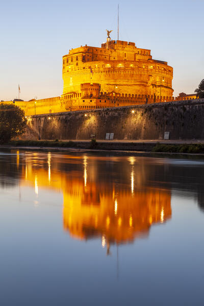Castel Sant'Angelo (Castle of the Holy Angel) at dusk reflected on Tiber river, Rome, Lazio, Italy.