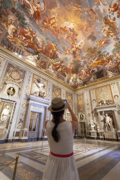 A tourist takes a shot of ceiling fresco in Galleria Borghese, Villa Borghese, Roma, Lazio, Italy (MR)