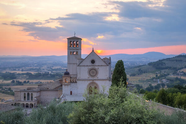 The facade of upper Basilica of Saint Francis of Assisi at sunset, Assisi, Perugia province, Umbria, Italy.
