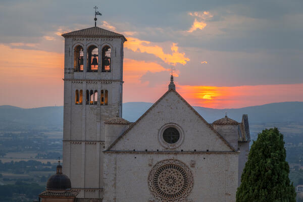 The facade of upper Basilica of Saint Francis of Assisi at sunset, Assisi, Perugia province, Umbria, Italy.