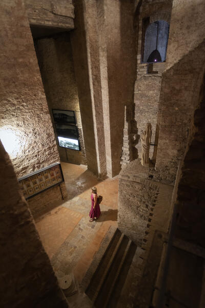 A tourist in the Rocca Paolina, a Renaissance fortress in Perugia, Umbria region, Italy.