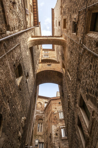 An alley in the medieval old town of Perugia, Umbra region, Italy.