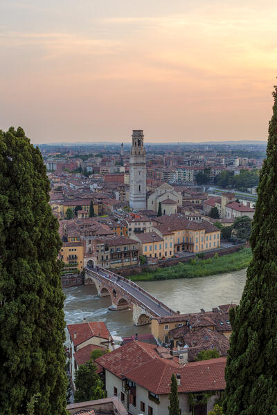 View of Ponte Pietra and Veron Cathedral at sunset from Castel S. Pietro, Verona, Veneto, Italy.