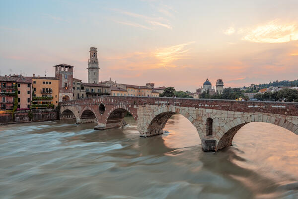 Ponte Pietra and river Adige at sunset, Verona, Veneto, Italy.