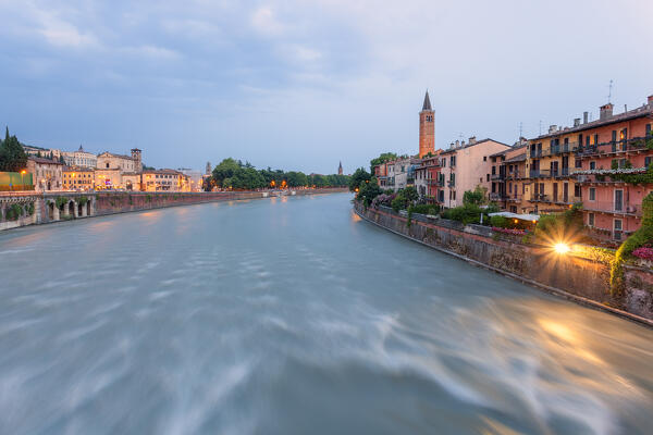 River Adige and Basilica of Saint Anastasia at dusk from Ponte Pietra. Verona, Veneto, Italy.
