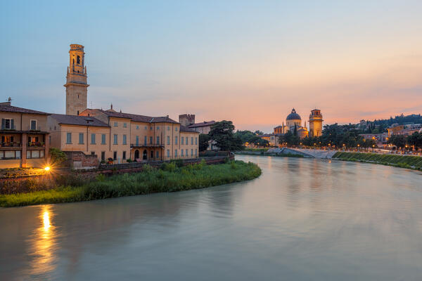 River Adige at sunset with the bell tower of Verona Cathedral on the left and San Giorgio in Braida on the right. Verona, Veneto, Italy.