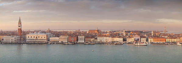 Panoramic view of San Marco Square and Schiavoni Bank from the bell tower of abbey of San Giorgio Maggiore at sunset, Venice, Veneto, Italy