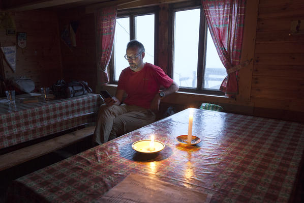 Relax at Punta Penia hut, Punta Penia, Marmolada group, Dolomites, Canazei, Trento province, Trentino-Alto Adige, Italy