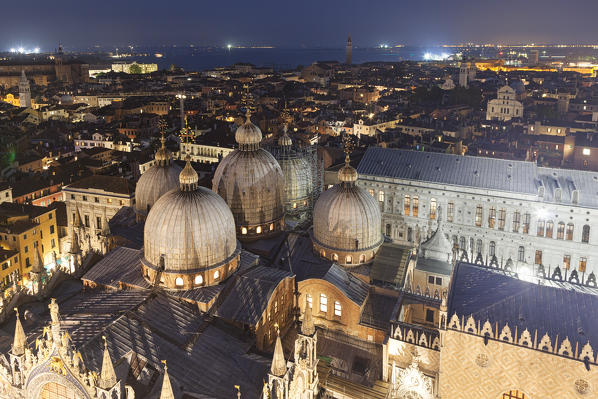 The domes of St. Mark's Basilica seen from the top of St. Mark's Campanile by night, Venice, Veneto, Italy.