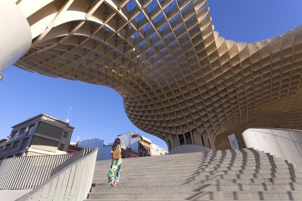 A tourist under Metropol Parasol, Seville, province of Seville, Andalusia, Spain