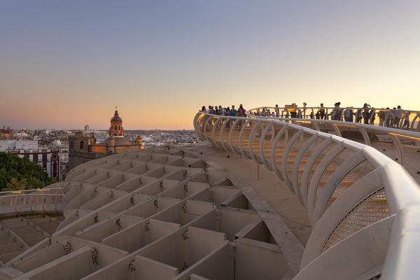 Tourists on the upper level of Metropol Parasol at sunset, Seville, province of Seville, Andalusia, Spain