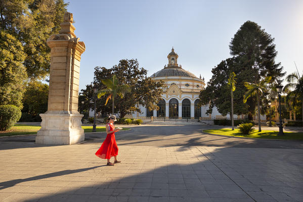 A woman in fron of Teatro Lope de Vega (Lope de Vega Theatre), Maria Luisa Park, Seville, province of Seville, Andalusia, Spain (MR)