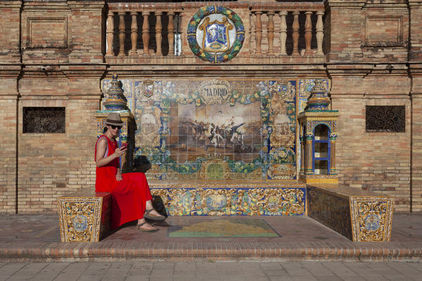 The tiled Provincial Alcoves along the walls of the Plaza de España, Maria Luisa Park, Seville, province of Seville, Andalusia, Spain