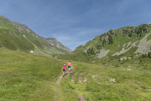 Selva dei Molini, province of Bolzano, South Tyrol, Italy, Europe. Hikers on the trail to the Edelraut refuge (MR)