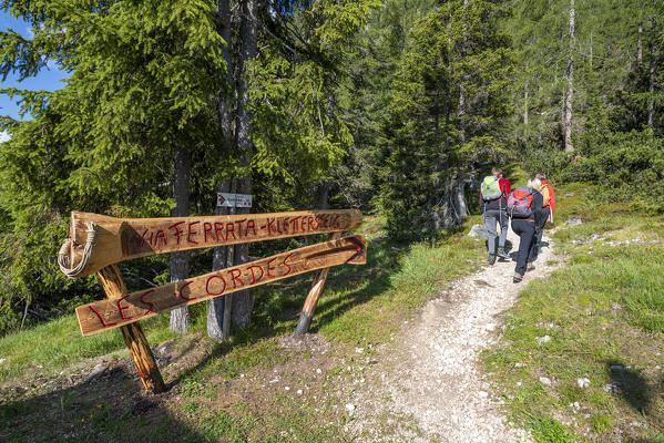 Alta Badia, La Villa, Dolomites, province of Bolzano, South Tyrol, Italy, Europe. Mountaineers on approach to the via ferrata 