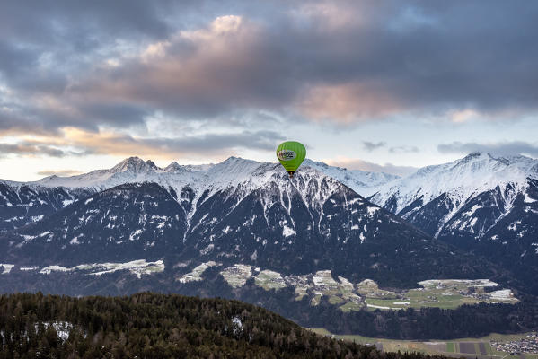 Seefeld, Tyrol, Austria, Europe. Crossing the alps in a hot air balloon. The hot air balloon above the Inn Valley