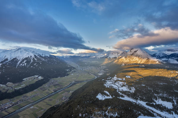 Seefeld, Tyrol, Austria, Europe. Crossing the alps in a hot air balloon. Sunrise at the Inn Valley with the peak of the Hohe Munde