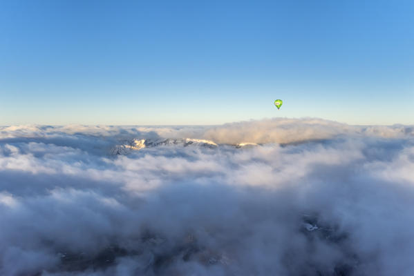 Seefeld, Tyrol, Austria, Europe. Crossing the alps in a hot air balloon. Under the fog the Inn Valley