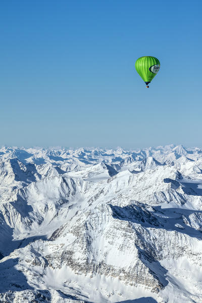 Passiria Valley, Bolzano district, South Tyrol, Italy, Europe. Crossing the alps in a hot air balloon. View from the Balloon to the Texel Group, the Ötztal Mountains and the Silvretta Mountains