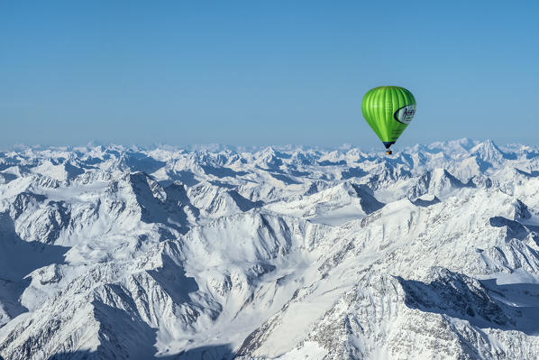 Passiria Valley, Bolzano district, South Tyrol, Italy, Europe. Crossing the alps in a hot air balloon. View from the Balloon to the Texel Group, the Ötztal Mountains and the Silvretta Mountains