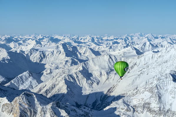 Passiria Valley, Bolzano district, South Tyrol, Italy, Europe. Crossing the alps in a hot air balloon. View from the Balloon to the Texel Group, the Ötztal Mountains and the Silvretta Mountains