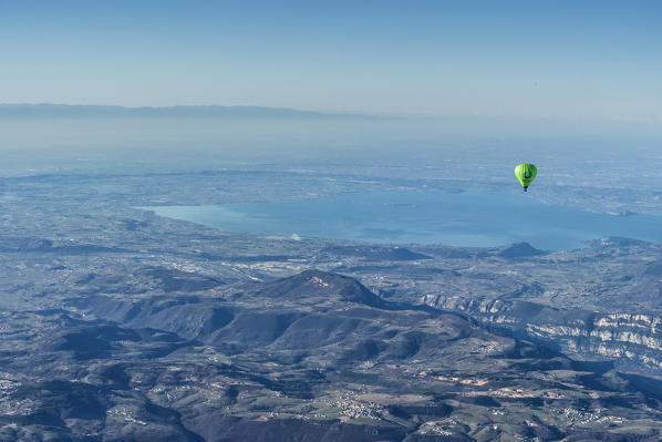 Verona, Prealps, Veneto, Italy Europe. Crossing the alps in a hot air balloon. View from the Balloon to the Lake Garda and the Padana Plain