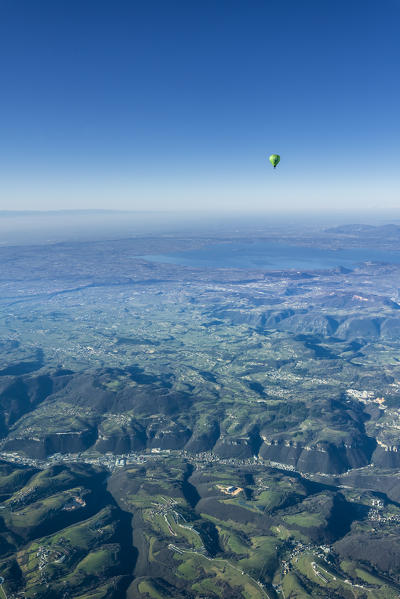 Verona, Prealps, Veneto, Italy Europe. Crossing the alps in a hot air balloon. View from the Balloon to the Lake Garda and the Padana Plain