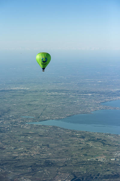 Verona, Prealps, Veneto, Italy Europe. Crossing the alps in a hot air balloon. View from the Balloon to the Lake Garda and the Padana Plain