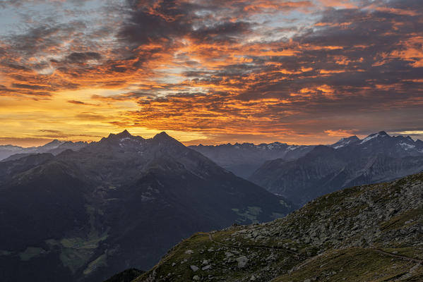 Sand in Taufers / Campo Tures, Bolzano province, South Tyrol, Italy. Sunrise at the summit of Speikboden