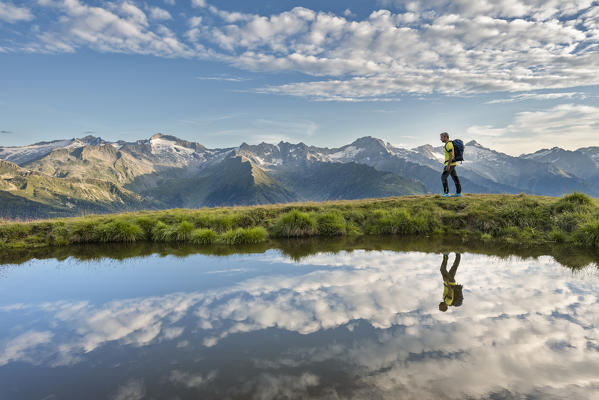 Sand in Taufers / Campo Tures, Bolzano province, South Tyrol, Italy. A hiker at the Kellerbauer mountain trail (MR)