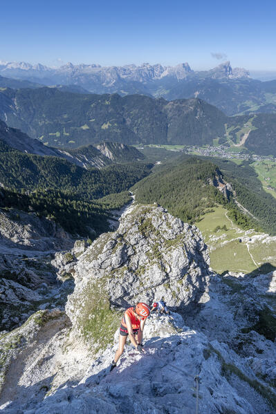 Valdaora / Olang, Bolzano province, South Tyrol, Italy, Europe. A girl on the via ferrata to the summit of Piz da Peres