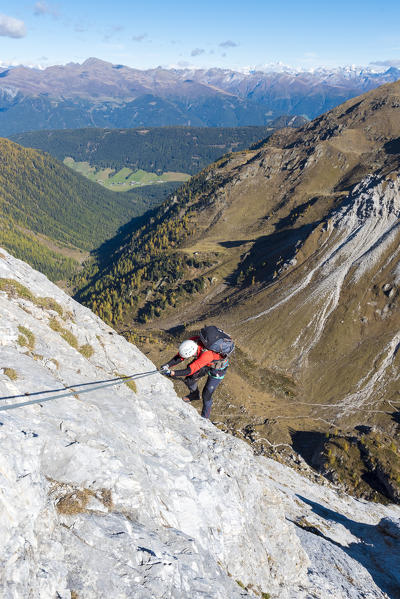 Mount Grosse Kinigat, Kartitsch, East Tyrol, Austria, Europe. Climber on the via ferrata