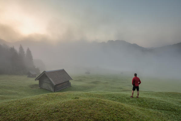 Gerold Lake, Krün, Garmisch-Partenkirchen district, Upper Bavaria, Bavaria, Germany, Europe. Misty sunrise at Gerold Lake with the Karwendel Alps in the background