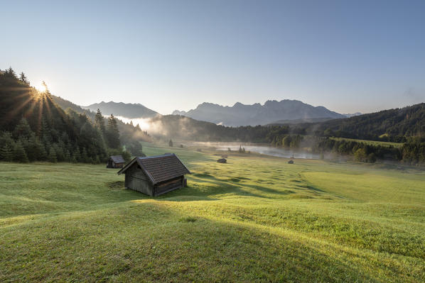 Gerold Lake, Krün, Garmisch-Partenkirchen district, Upper Bavaria, Bavaria, Germany, Europe. Sunrise at Gerold Lake with the Karwendel Alps in the background