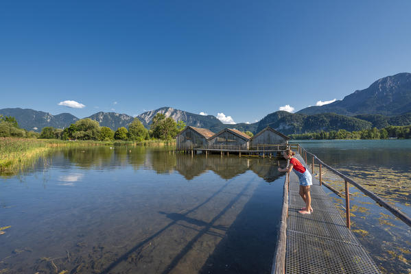 Schlehdorf, Kochel Lake, Bad Tölz-Wolfratshausen district, Upper Bavaria, Germany, Europe. Three boathouses in the Kochel Lake