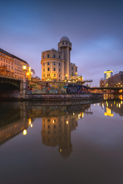 Vienna, Austria, Europe. The Urania reflected in the Danube Canal