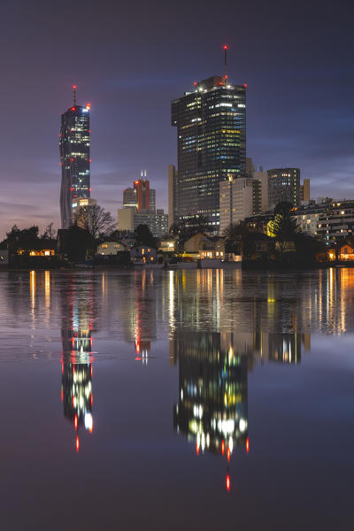 Vienna, Austria, Europe. The skyscrapers of Donau City in the evening sunset and blue hour.