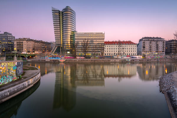 Vienna, Austria, Europe. The Uniqa Tower reflected in the Danube Canal