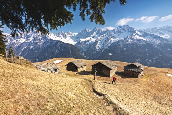 Hiker in Tombal in Bregaglia Valley, Switzerland, Maloja district, Canton of Graubünden