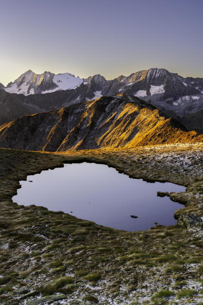 Autumn sunrise in Tonale pass, Ponte di Legno in Brescia province, Lombardy district in Italy.