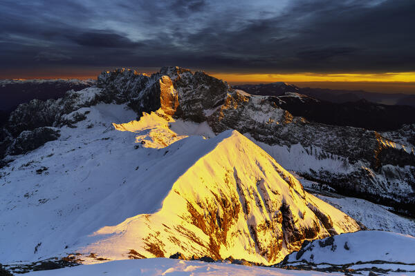Sunset from Monte Ferrante in winter season, Orobie Alps in Bergamo province, Lombardy district, Italy, Europe.