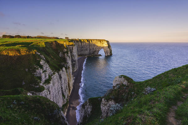 Arch in Etretat at sunrise ,Normandy,France.