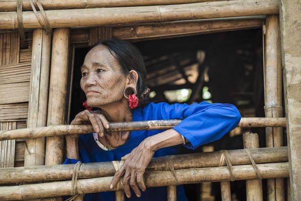Rakhine state, Myanmar. Chin woman with traditional tattooed face.