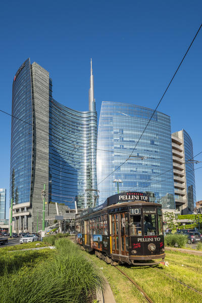 Milan, Lombardy, Italy. Iconic tramway with Porta Nuova business district in the background.
