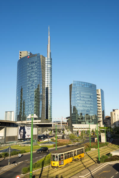 Milan, Lombardy, Italy. Iconic tramway with Porta Nuova business district in the background.