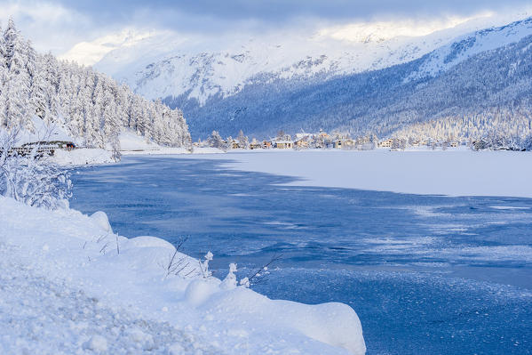Frozen alpine lake in winter. Engadine, Switzerland