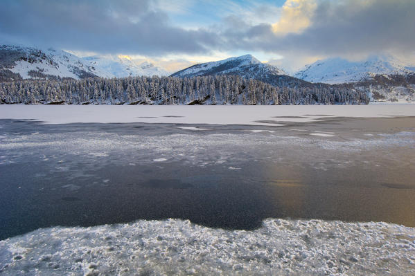 Frozen alpine lake in winter. Engadine, Switzerland