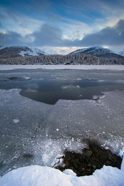 Frozen alpine lake in winter. Engadine, Switzerland
